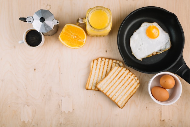 Delicious breakfast on wooden background