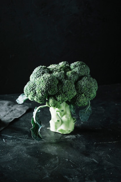 Free photo delicious broccoli on a grunge black background