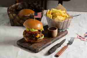 Free photo delicious burger with usa flag and fries  high angle