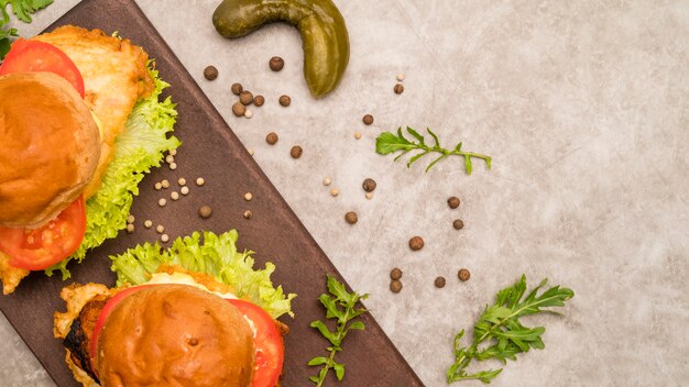 Delicious burgers on grey table