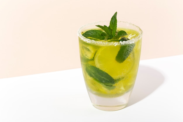 Delicious caipirinha cocktail with mint high angle