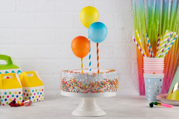 Delicious cake and balloons assortment