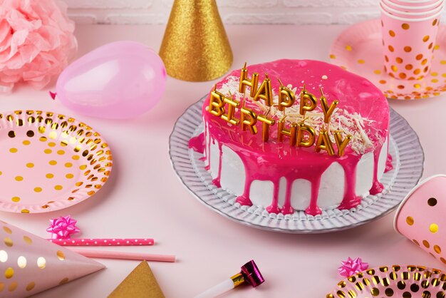 delicious cake and party ornaments high angle