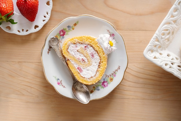 Delicious cake and strawberries top view