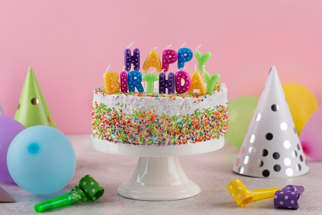 Delicious cake with birthday items