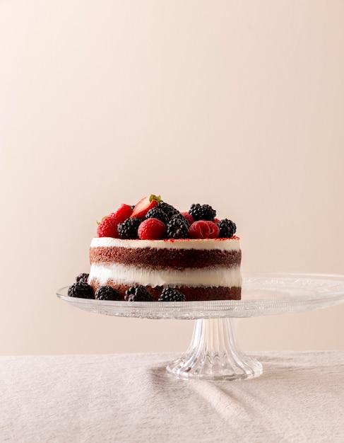 Delicious cake with forest fruits composition