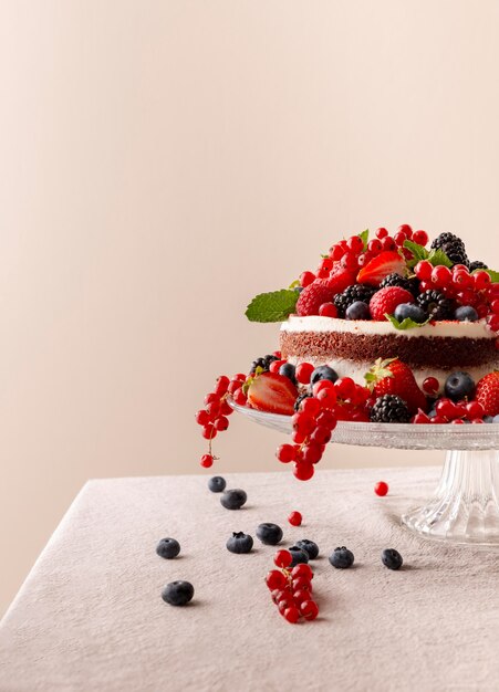 Delicious cake with forest fruits composition