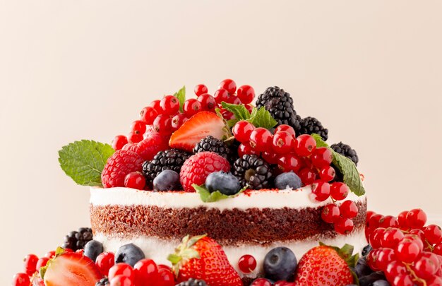 Delicious cake with forest fruits composition