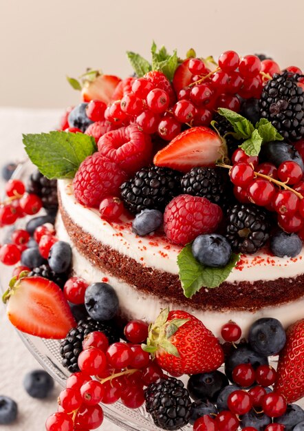 Delicious cake with forest fruits composition