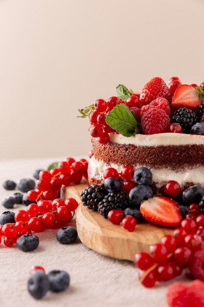 Delicious cake with forest fruits composition