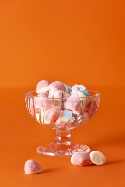 Delicious candy with orange background