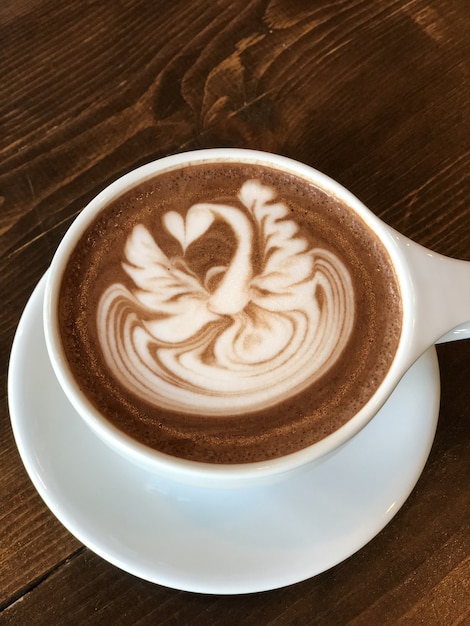 Delicious cappuccino with a beautiful painting on the foam