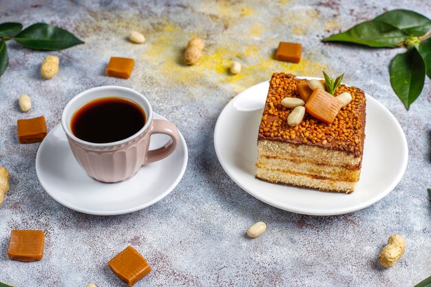 Delicious caramel and peanut cake with peanuts and caramel candies, top view