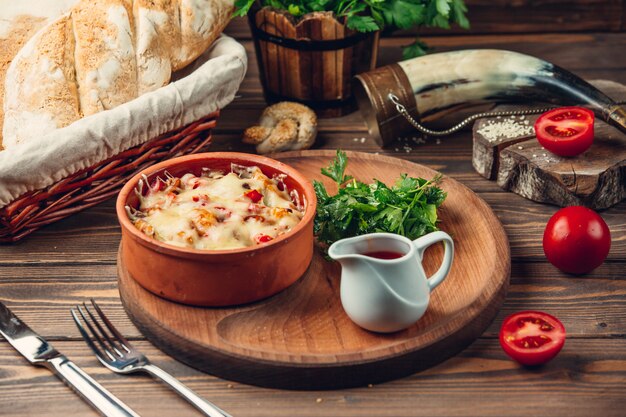 Delicious casserole on a wooden stand