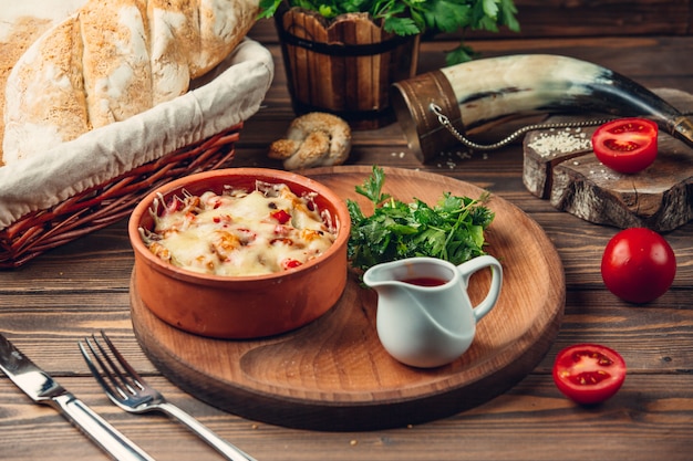 Delicious casserole on a wooden stand