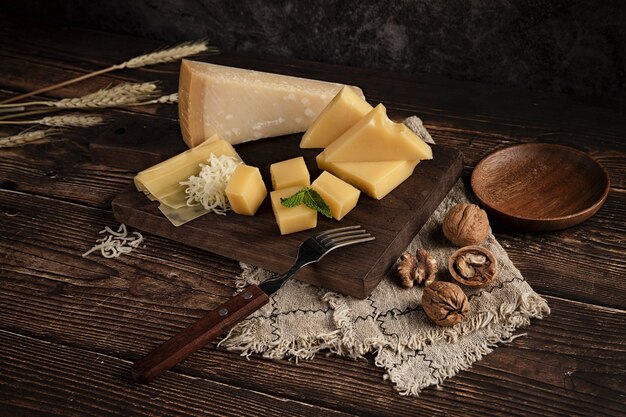 Delicious cheese platter on the table with walnuts on it