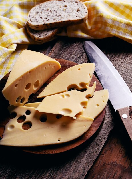 Delicious cheese on wooden board