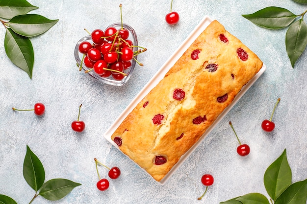 Delicious cherry cake with fresh cherries, top view