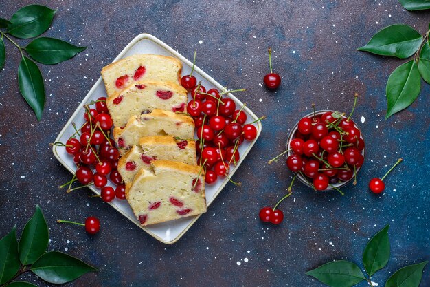 Delicious cherry cake with fresh cherries, top view