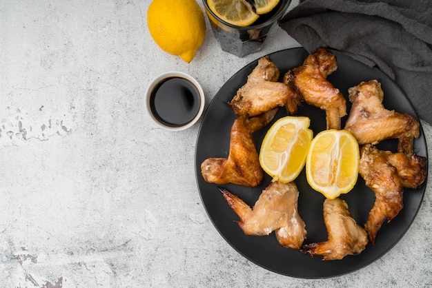 Delicious chicken wings coffee and lemons