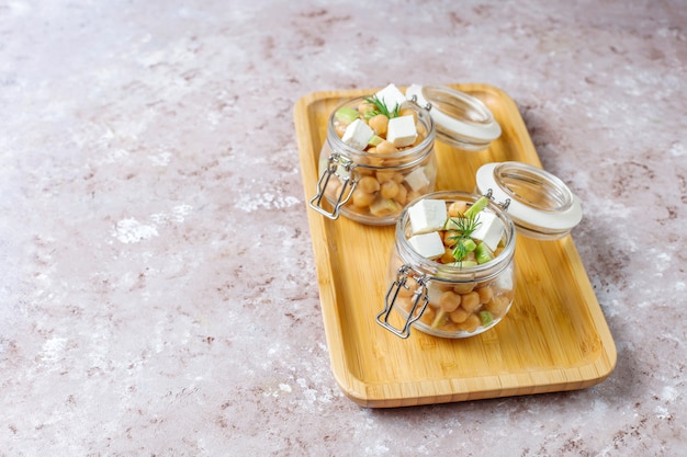 Delicious chickpea salad with avocado and feta cheese,top view