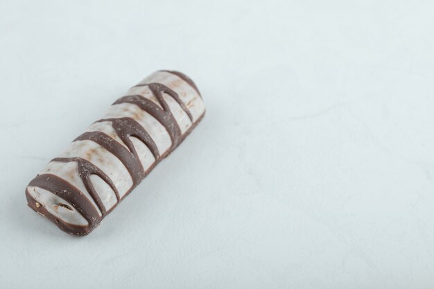 Delicious chocolate bar on white.