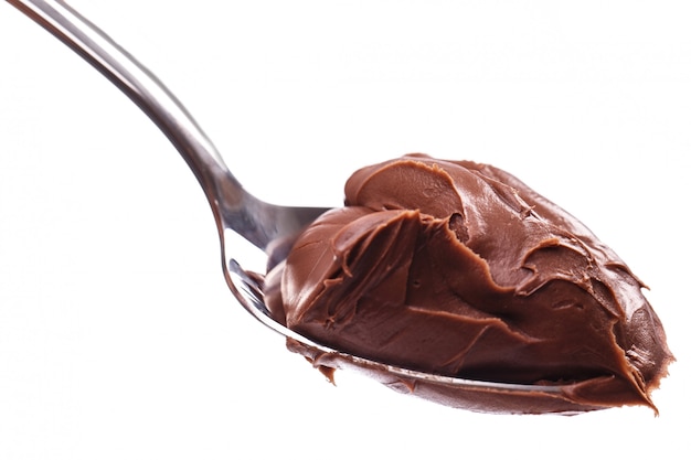 Delicious chocolate cream on a spoon