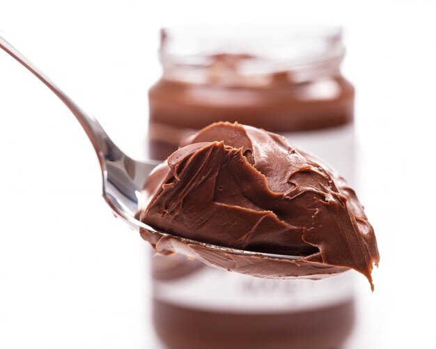 Delicious chocolate cream on a spoon