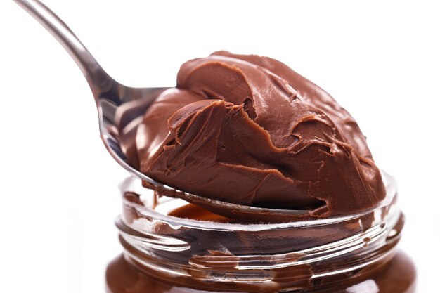 Delicious chocolate cream on a spoon