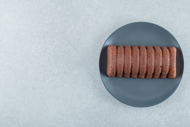 Delicious chocolate pie on a dark plate. 