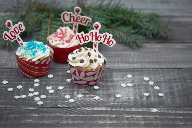 Delicious christmas muffins on wooden planks