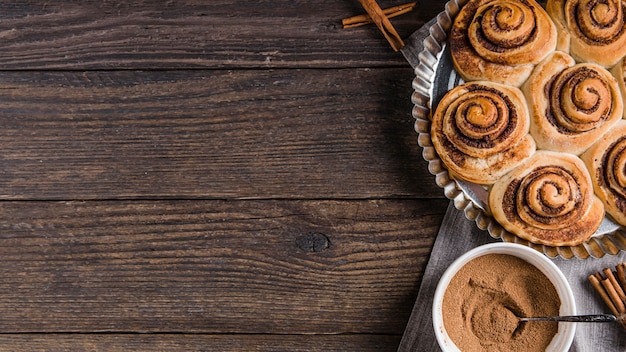 Free photo delicious cinnamon rolls with copy space