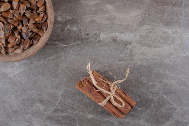 Delicious cinnamon and seeds on the marble surface