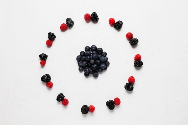 Delicious circle of wild berries and strawberries