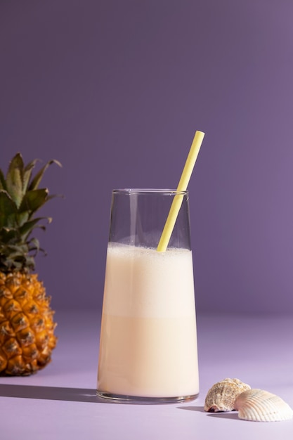 Delicious cocktail on purple background