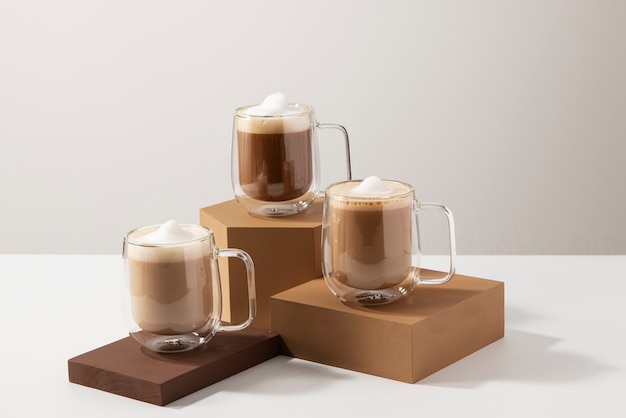 Delicious coffee cups with foam arrangement