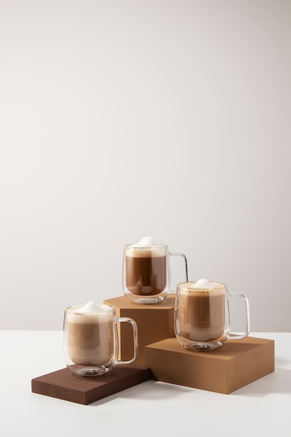 Free photo delicious coffee cups with foam