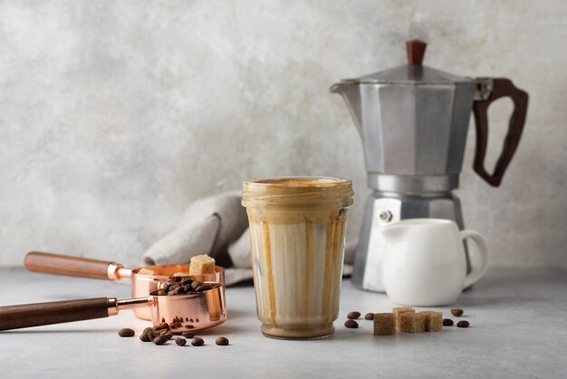 Delicious coffee with milk and  sugar cubes