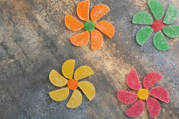 Delicious colorful marmalade on marble background. High quality photo