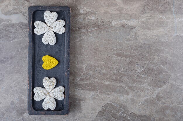 Delicious cookie on the tray on the marble surface