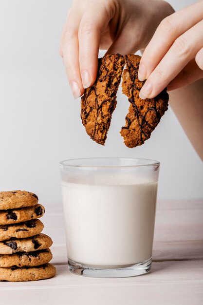 Delicious cookies next to glass of milk