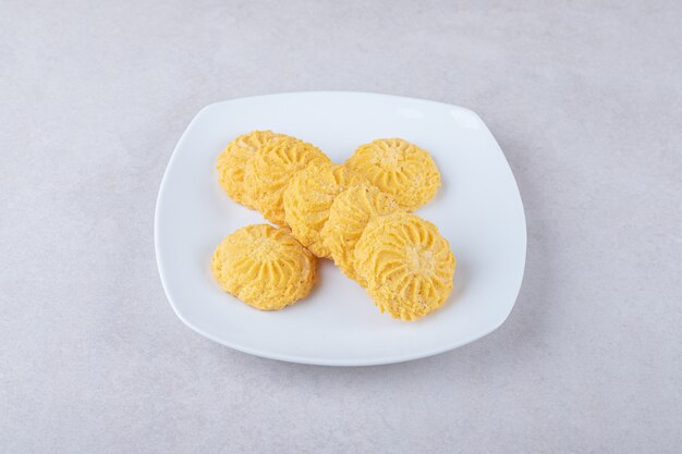 Delicious cookies on a plate, on the marble.