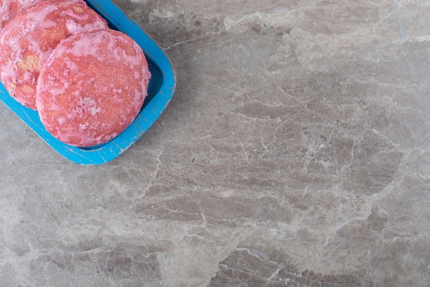 Delicious cookies on a platter on marble surface