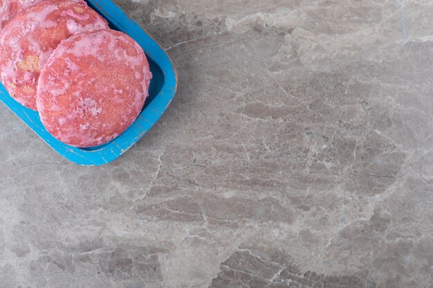 Delicious cookies on a platter on marble surface