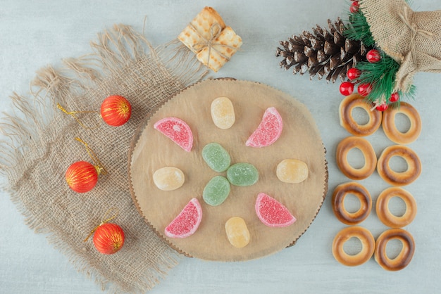 Delicious cookies with Christmas balls on sackcloh . High quality photo