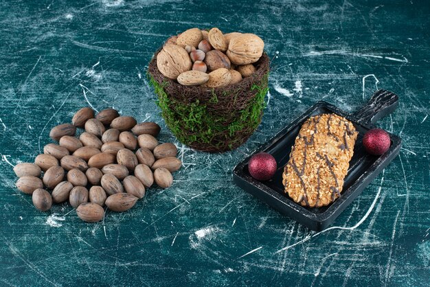 Free photo delicious cookies with various nuts and christmas balls. high quality photo