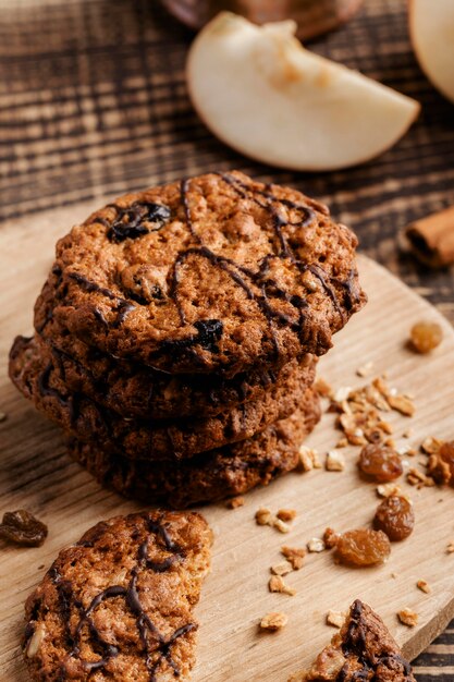 Delicious cookies on wooden board close up