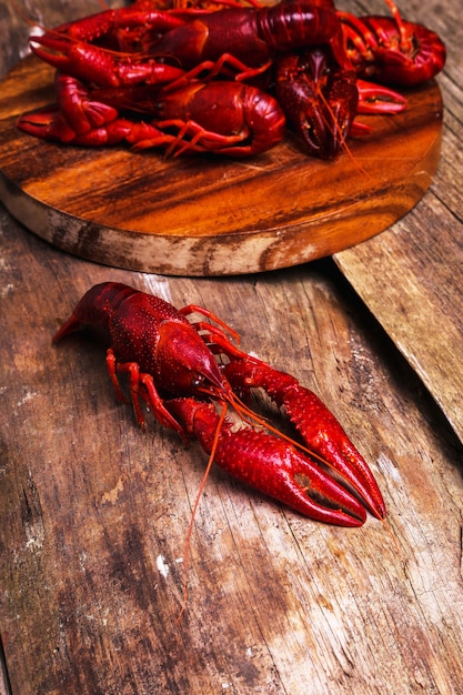 Delicious crayfishes on wooden tray