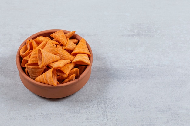 Delicious crispy crackers in ceramic bowl.