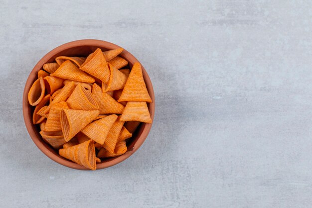 Delicious crispy crackers in ceramic bowl.